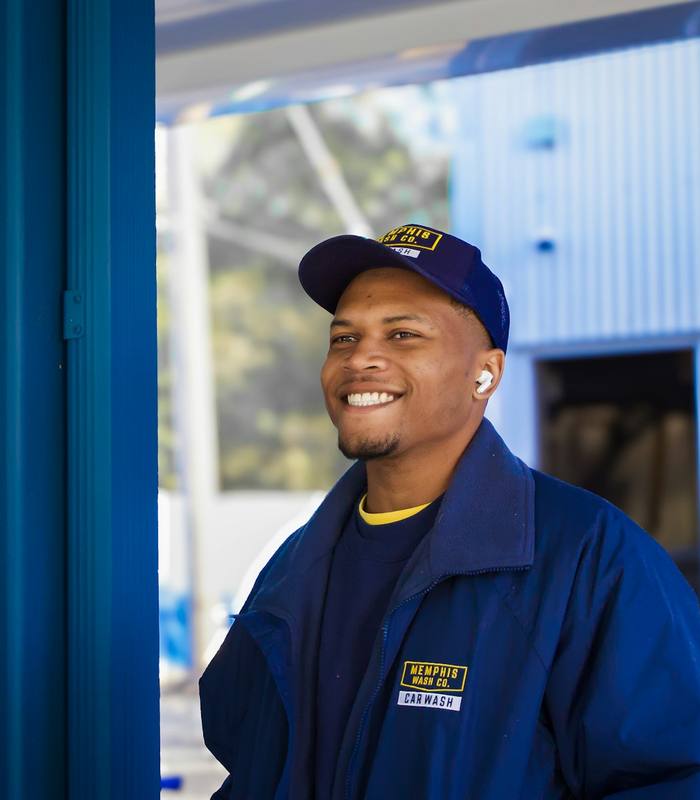 Smiling appliance technician in uniform